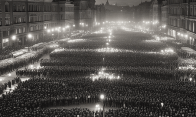 Thousands of peaceful protesters gather in Prague during the 1989 Velvet Revolution holding keys and candles