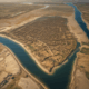 Aerial view of ancient Mesopotamian river system showing tidal influence on early urban development