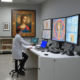 Art restoration science conservator using X-ray technology to analyze Renaissance