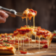 Melted cheese pizza slice showing flavor pairing science with tomatoes