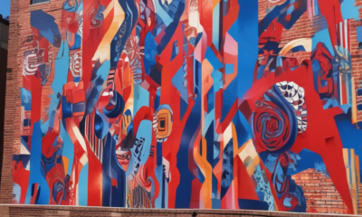 Person stopping to view colorful street art mural demonstrating street